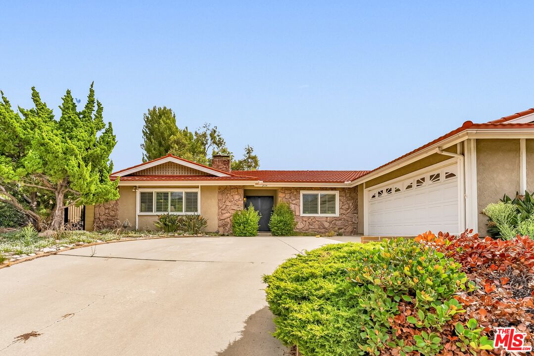 2774 Monticello Road Claremont, CA 91711 - Photo 1 of 34 a front view of a house with a garden