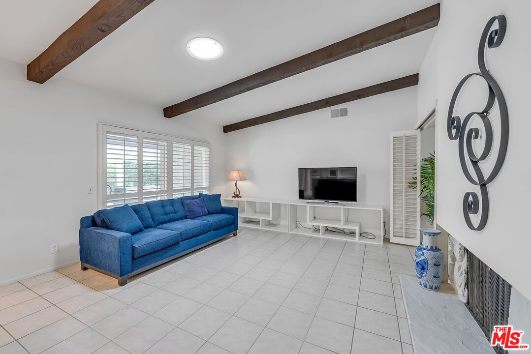 2774 Monticello Road Claremont, CA 91711 - Photo 11 of 34 a living room with furniture and a flat screen tv