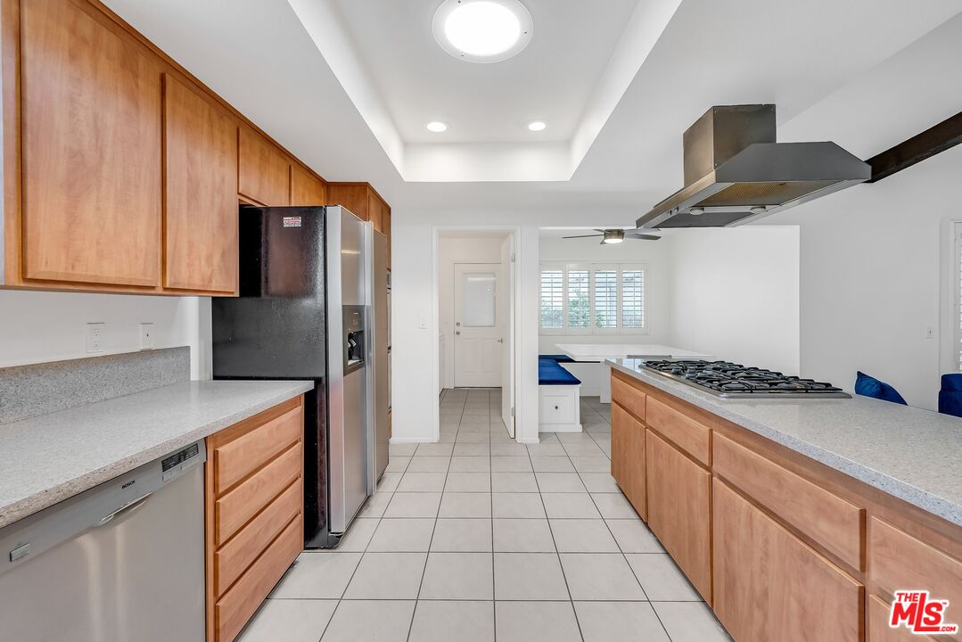 2774 Monticello Road Claremont, CA 91711 - Photo 12 of 34 a kitchen with stainless steel appliances granite countertop a stove a refrigerator and a sink