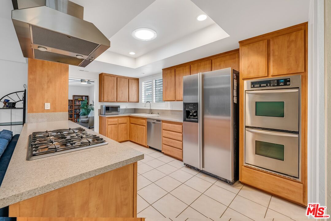 2774 Monticello Road Claremont, CA 91711 - Photo 13 of 34 a kitchen with stainless steel appliances granite countertop a stove a refrigerator and a stove top oven