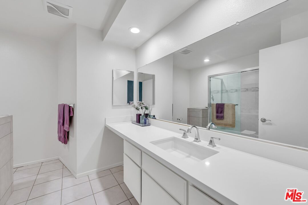 2774 Monticello Road Claremont, CA 91711 - Photo 17 of 34 a bathroom with a sink and a mirror