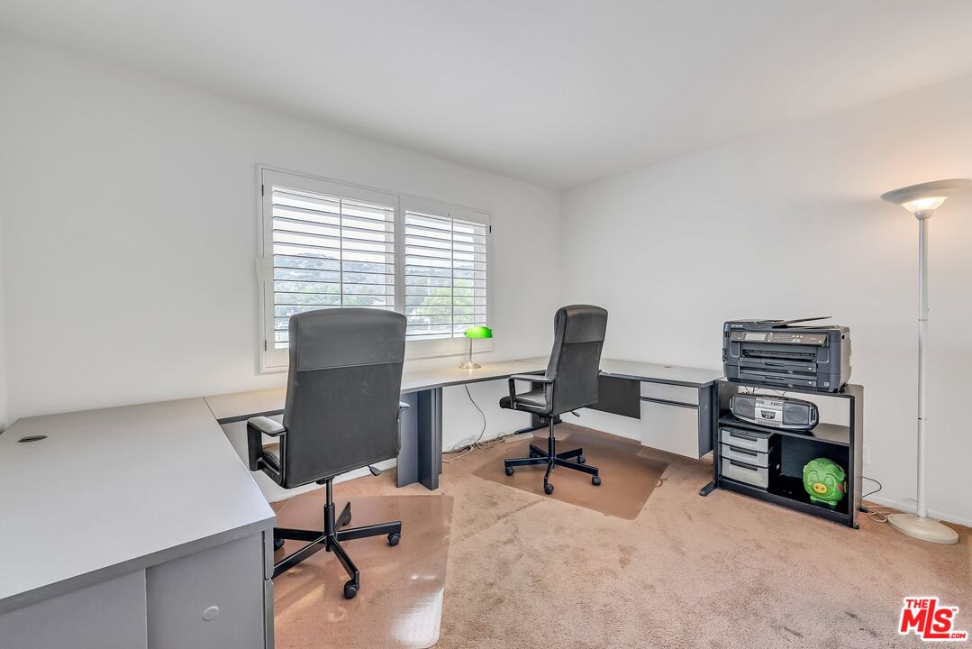 2774 Monticello Road Claremont, CA 91711 - Photo 19 of 34 a view of a workspace with furniture and a window