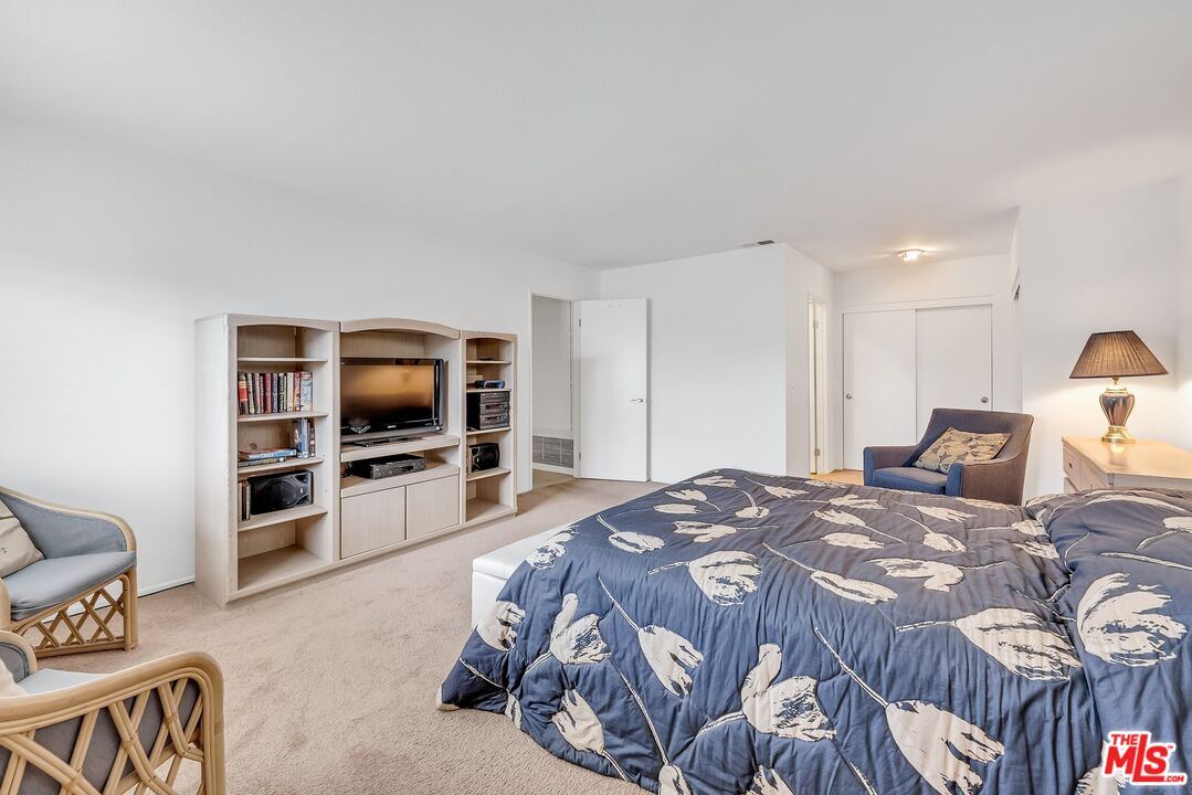 2774 Monticello Road Claremont, CA 91711 - Photo 22 of 34 a bedroom with a bed and a flat screen tv