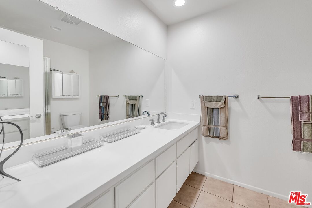 2774 Monticello Road Claremont, CA 91711 - Photo 23 of 34 a bathroom with a sink and a mirror