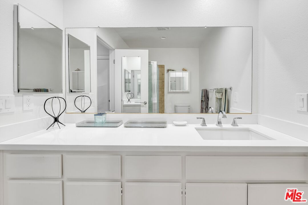 2774 Monticello Road Claremont, CA 91711 - Photo 24 of 34 a bathroom with a sink and a mirror