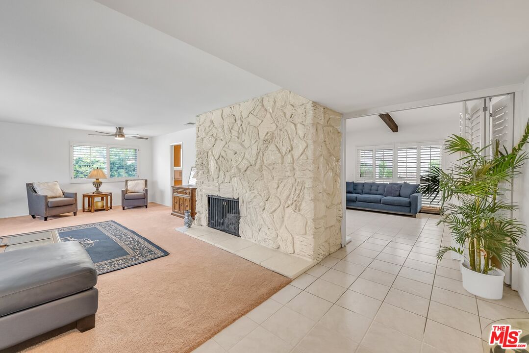 2774 Monticello Road Claremont, CA 91711 - Photo 4 of 34 a living room with furniture and a fireplace