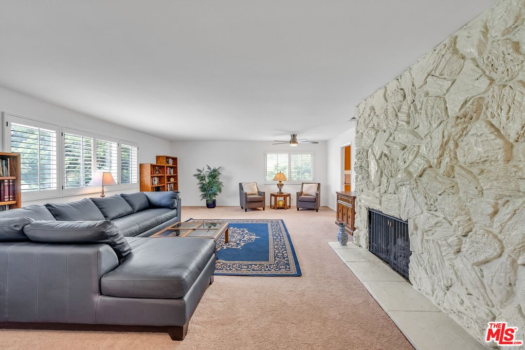 2774 Monticello Road Claremont, CA 91711 - Photo 5 of 34 a living room with a couch and a fireplace
