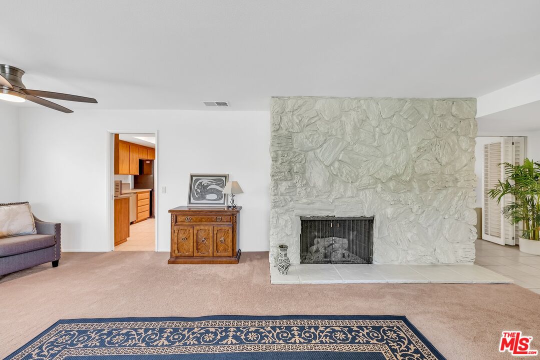 2774 Monticello Road Claremont, CA 91711 - Photo 8 of 34 a living room with furniture and a fireplace