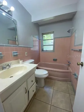 a bathroom with a sink a toilet and bathtub