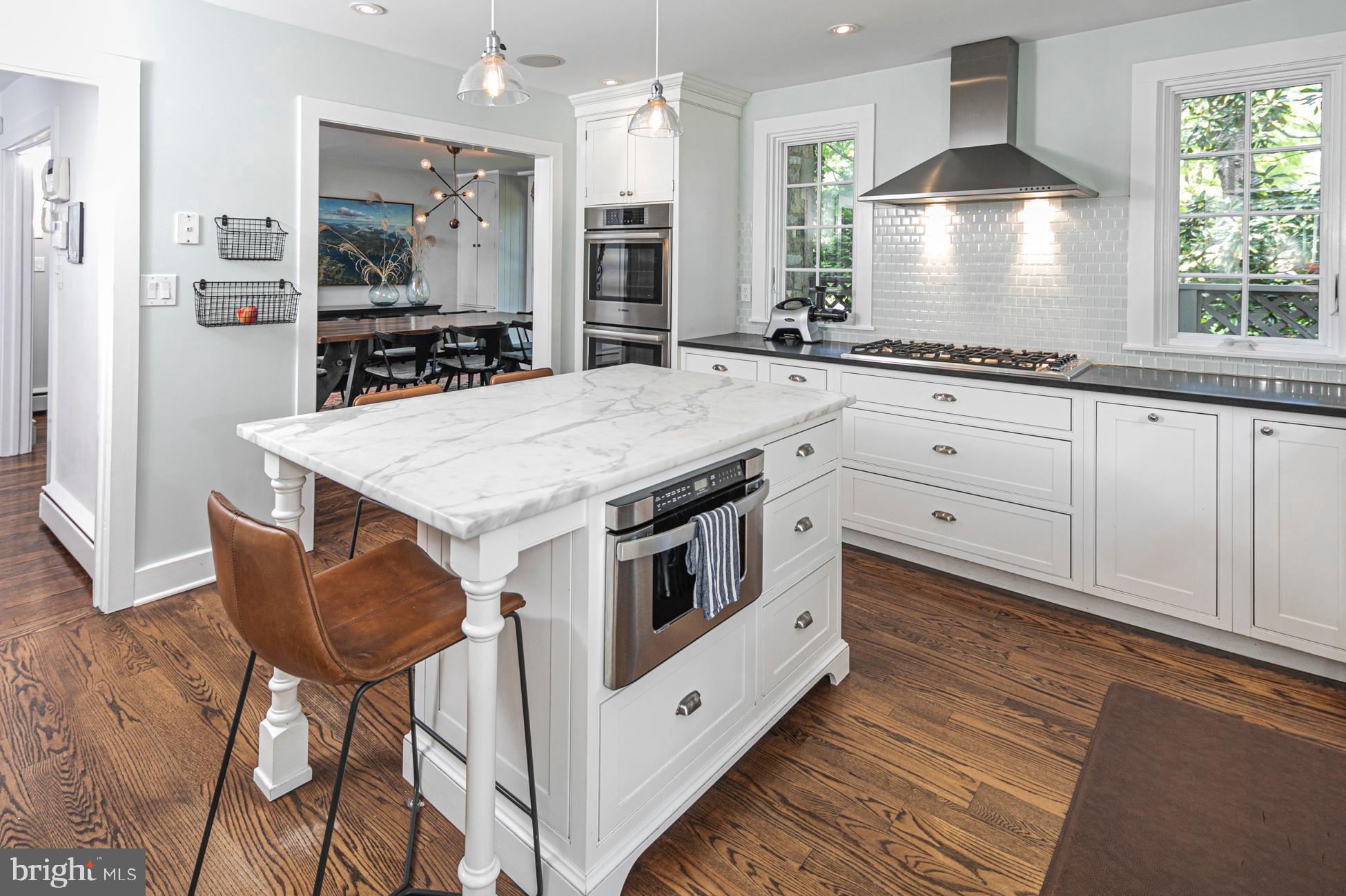 23 Hodge Road Princeton, NJ 08540 - Photo 11 of 34 a kitchen with stainless steel appliances kitchen island a large island in the center