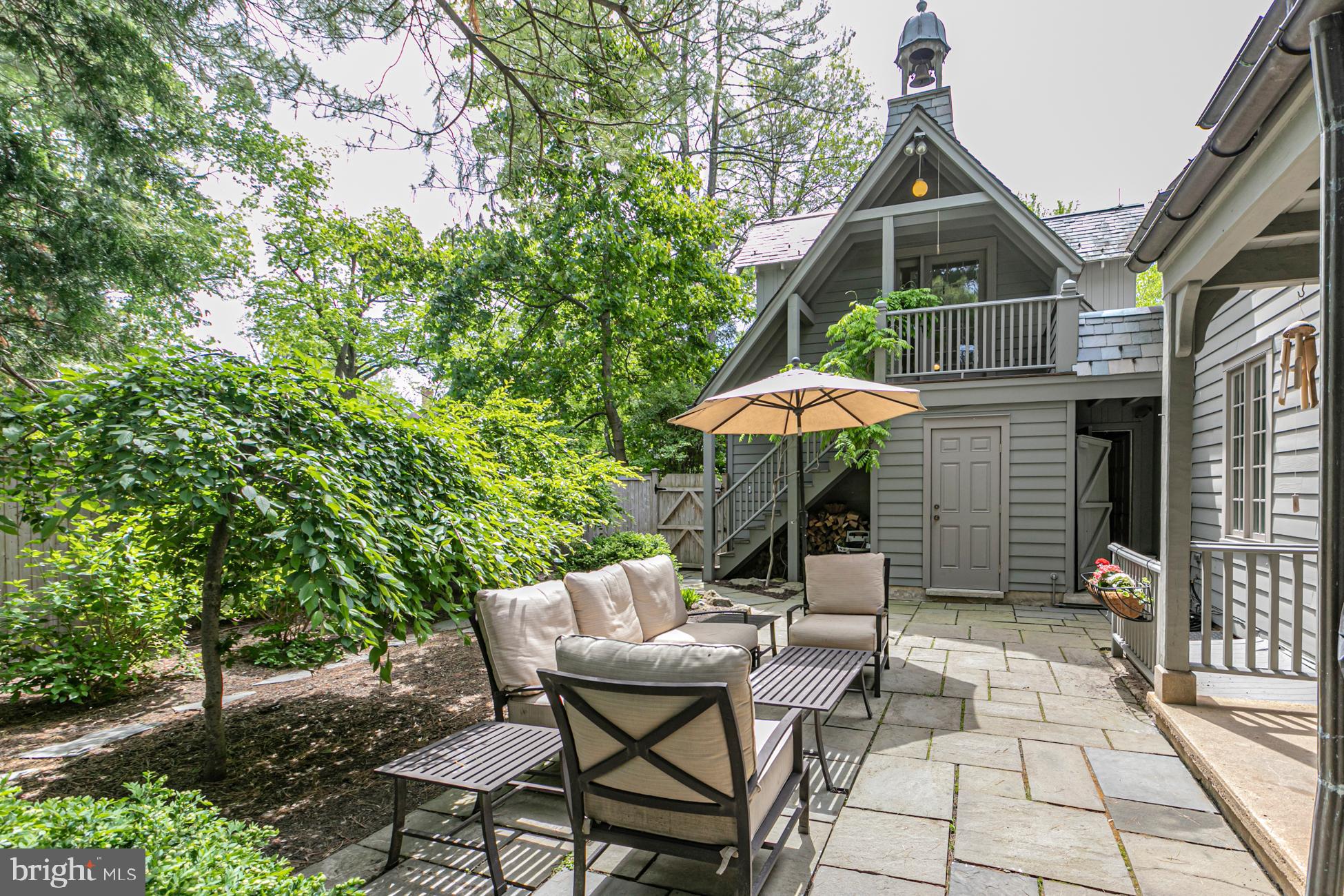 23 Hodge Road Princeton, NJ 08540 - Photo 26 of 34 a backyard of a house with table and chairs