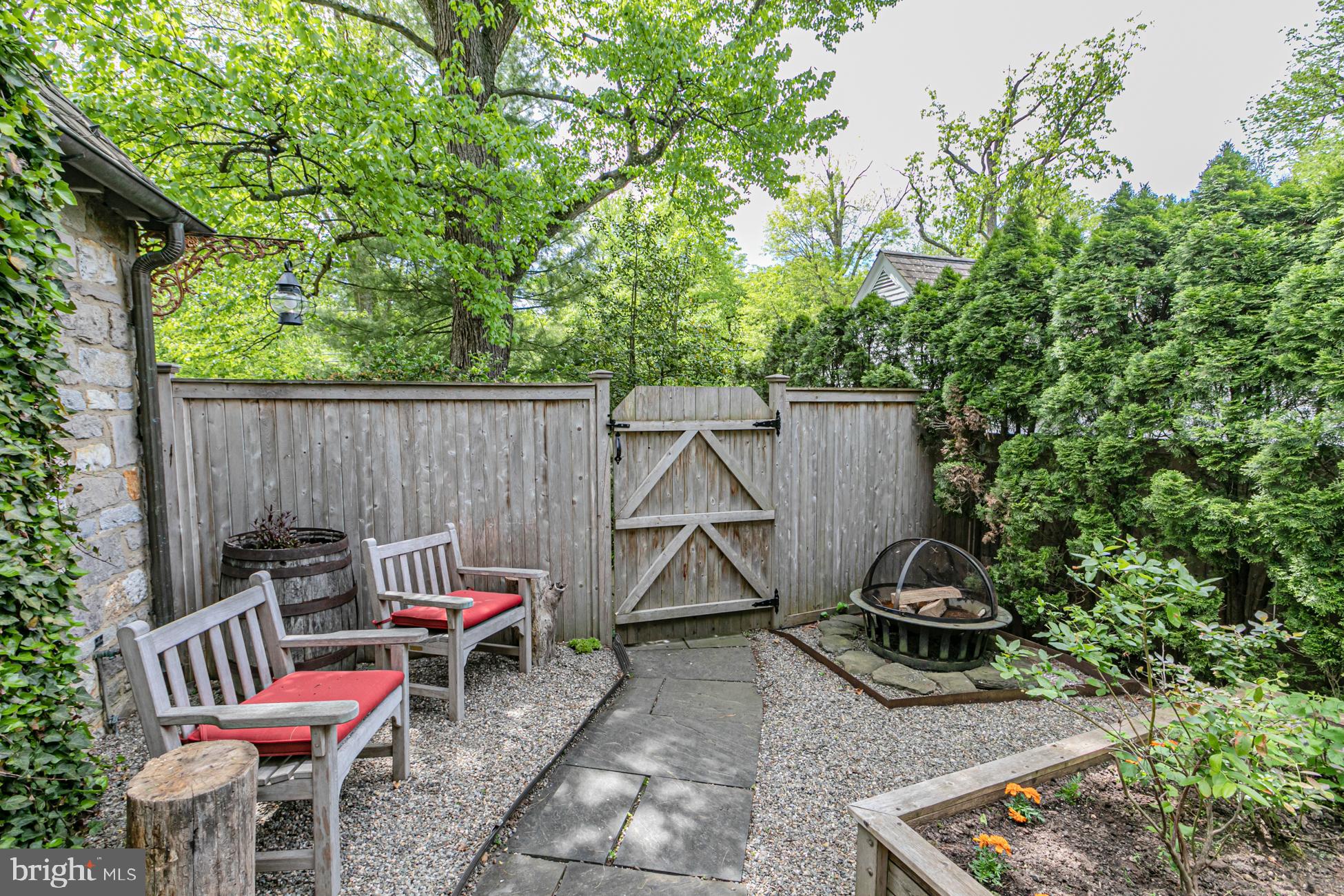 23 Hodge Road Princeton, NJ 08540 - Photo 33 of 34 a backyard of a house with table and chairs