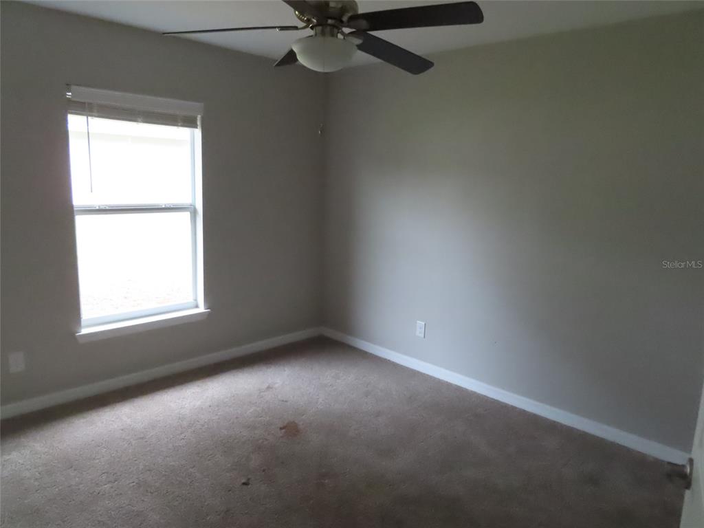 2501 Shirah Road Auburndale, FL 33823 - Photo 12 of 17 an empty room with a window