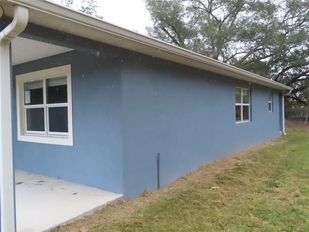 2501 Shirah Road Auburndale, FL 33823 - Photo 2 of 17 a view of backyard and tree