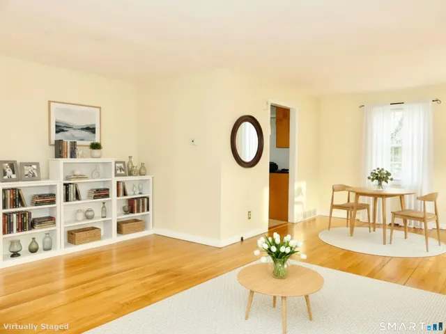 a living room with furniture and a table