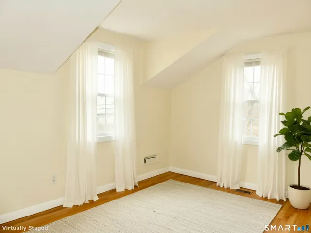 an empty room with windows and entrance
