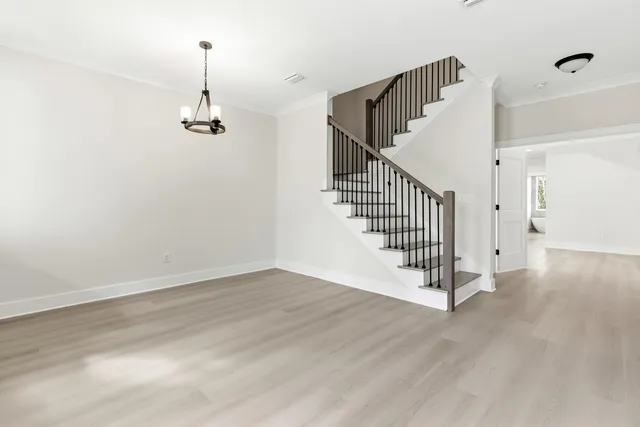 a view of empty room with stairs