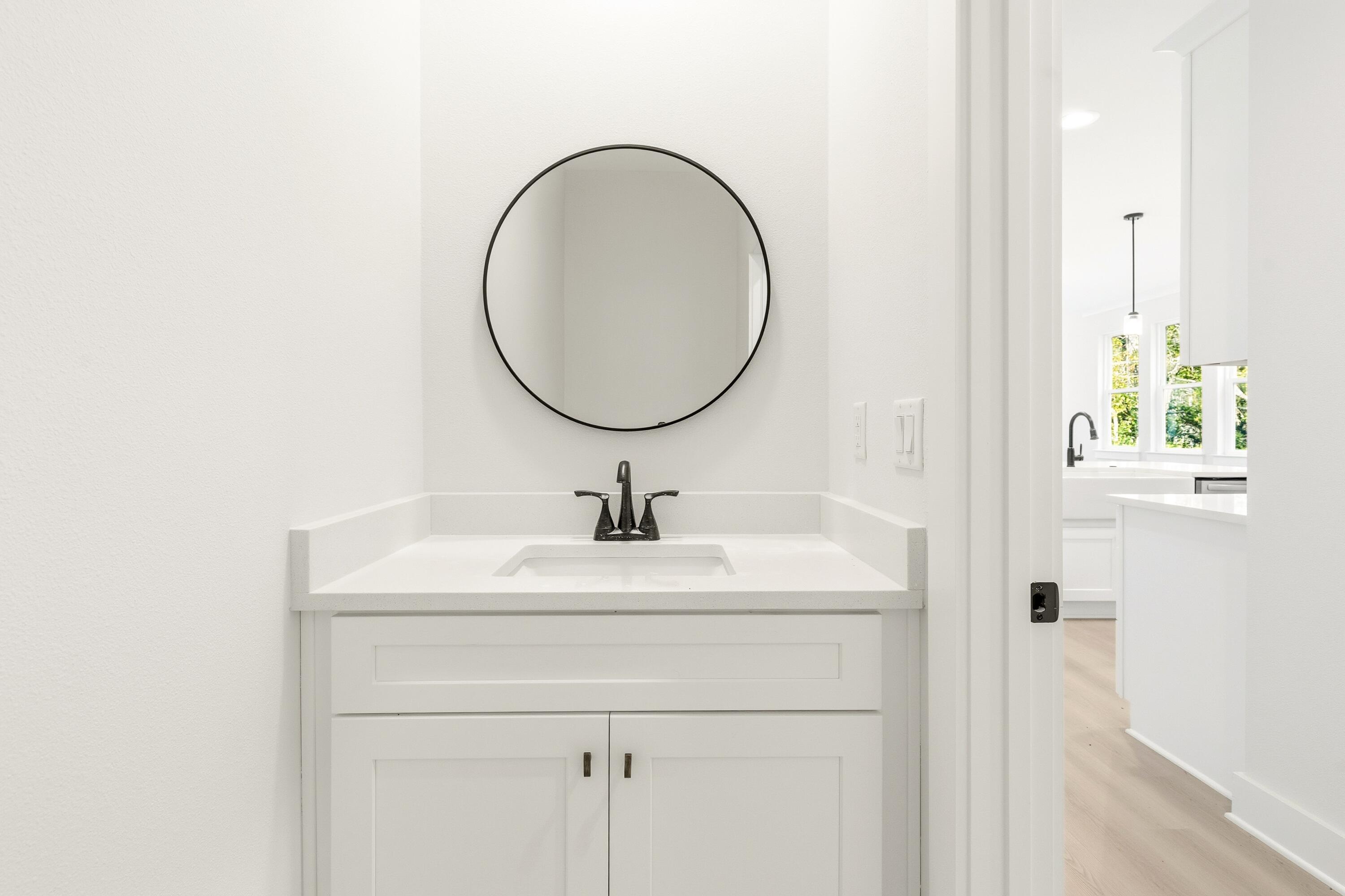 151 Redfish Pt Drive Freeport, FL 32439 - Photo 27 of 40 a bathroom with a sink and a mirror