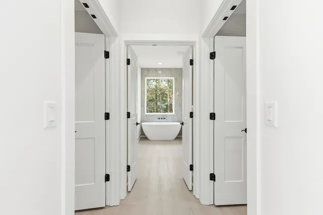 a view of a bathroom with a glass door and a window