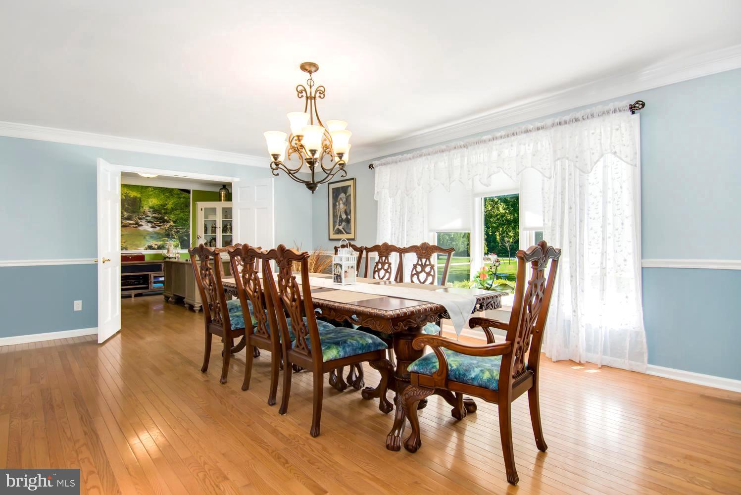 3204 Bennett Point Road Queenstown, MD 21658 - Photo 12 of 54 Chandeliered Formal Dining Room w/Chair Rail