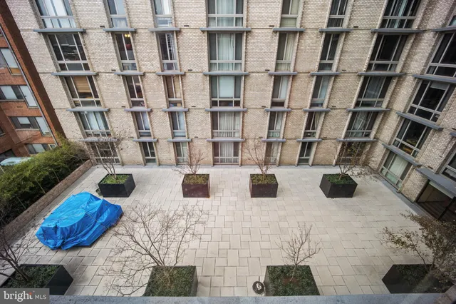 a view of a building with sitting area