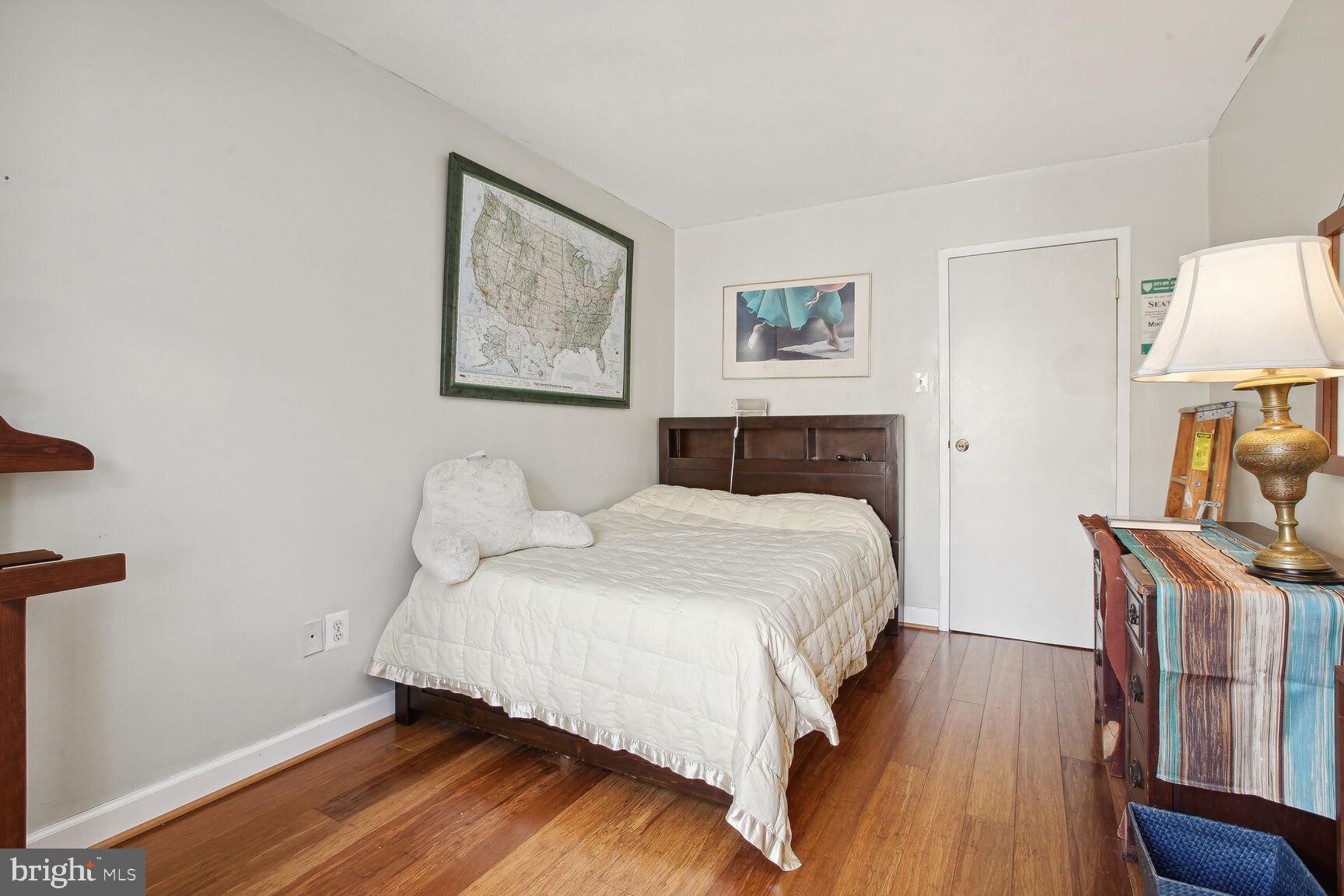 950 25th Street Northwest, Unit 608N Washington, DC 20037 - Photo 9 of 38 a bedroom with a bed and a flat screen tv