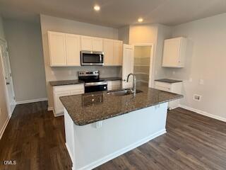 41 Stout Landing Dunn, NC 28334 - Photo 15 of 33 a kitchen with stainless steel appliances granite countertop a sink a stove and a microwave
