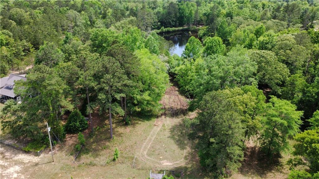 5591 Sandfort Road Seale, AL 36875 - Photo 5 of 10 Aerial view of property and surrounding area featuring a forest and a large body of water