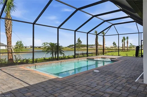 a view of a swimming pool with a porch