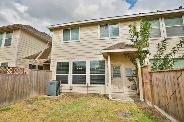 front view of a house with a large window