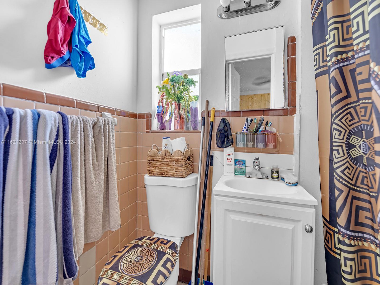 700 Northeast 6th Street Hallandale Beach, FL 33009 - Photo 12 of 15 a bathroom with a sink toilet and shower