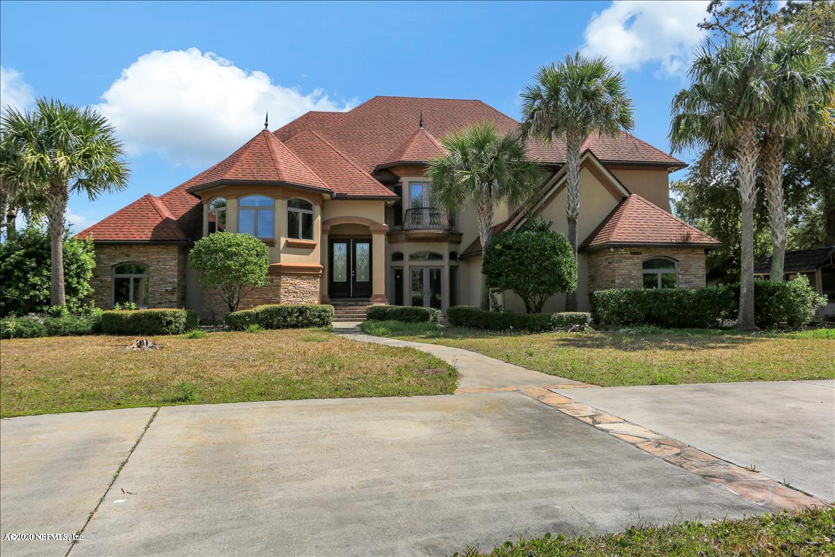 96270 Captains Pointe Road Yulee, FL 32097 - Photo 1 of 34 a front view of a house with a yard and garage
