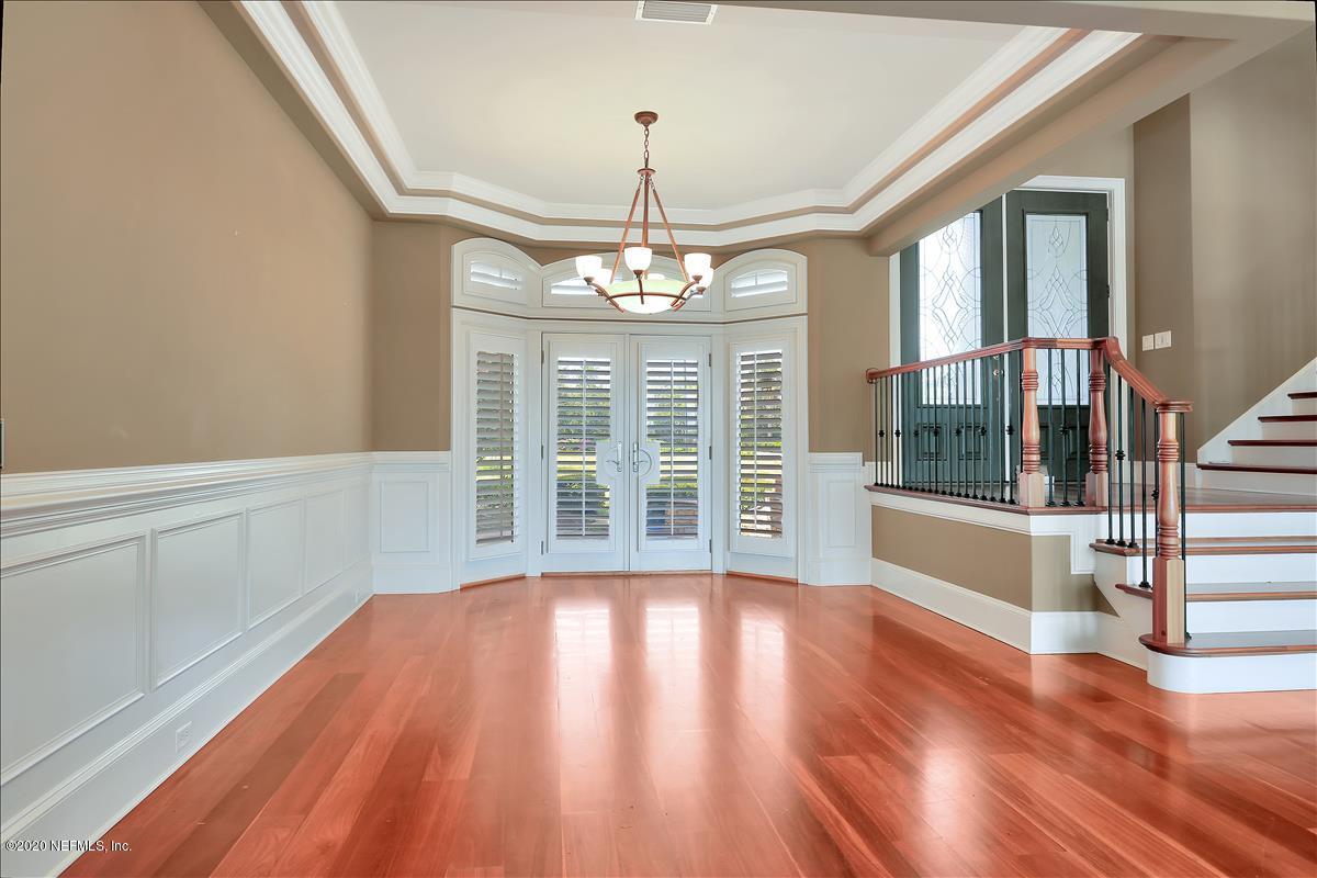 96270 Captains Pointe Road Yulee, FL 32097 - Photo 11 of 34 a view of an empty room with wooden floor and a window