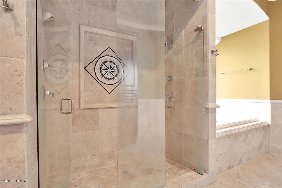 96270 Captains Pointe Road Yulee, FL 32097 - Photo 14 of 34 a view of bathroom with shower and mirror