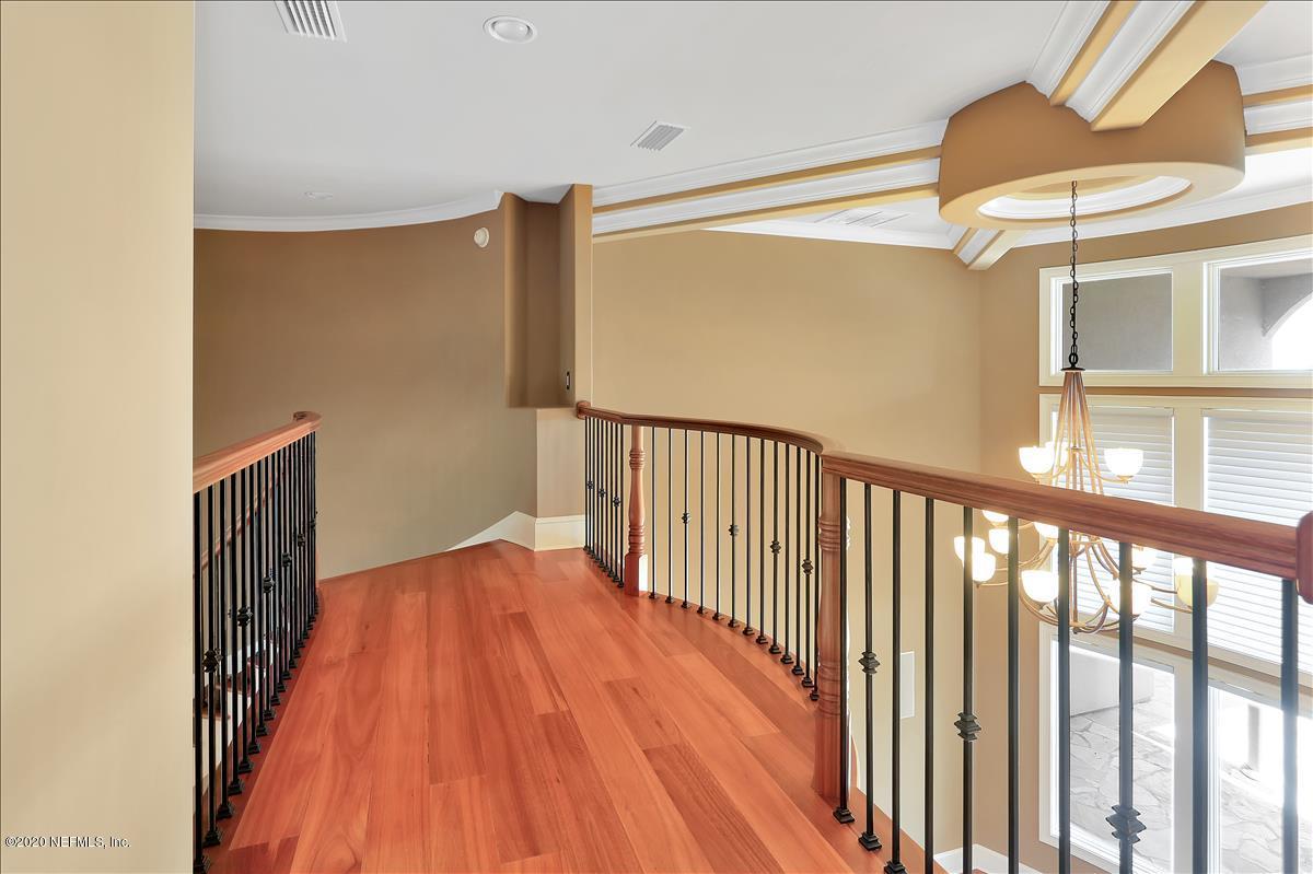 96270 Captains Pointe Road Yulee, FL 32097 - Photo 18 of 34 a view of staircase with railing and a chandelier