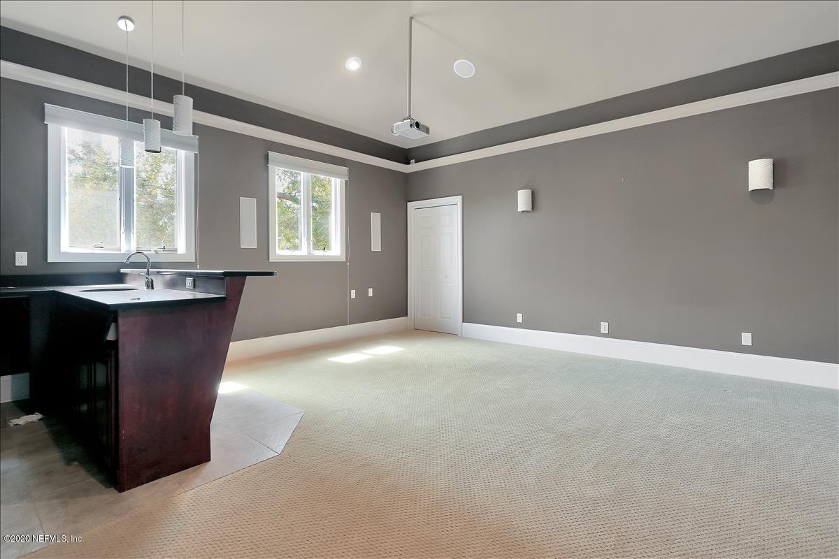 96270 Captains Pointe Road Yulee, FL 32097 - Photo 20 of 34 a view of a kitchen with a sink and chandelier