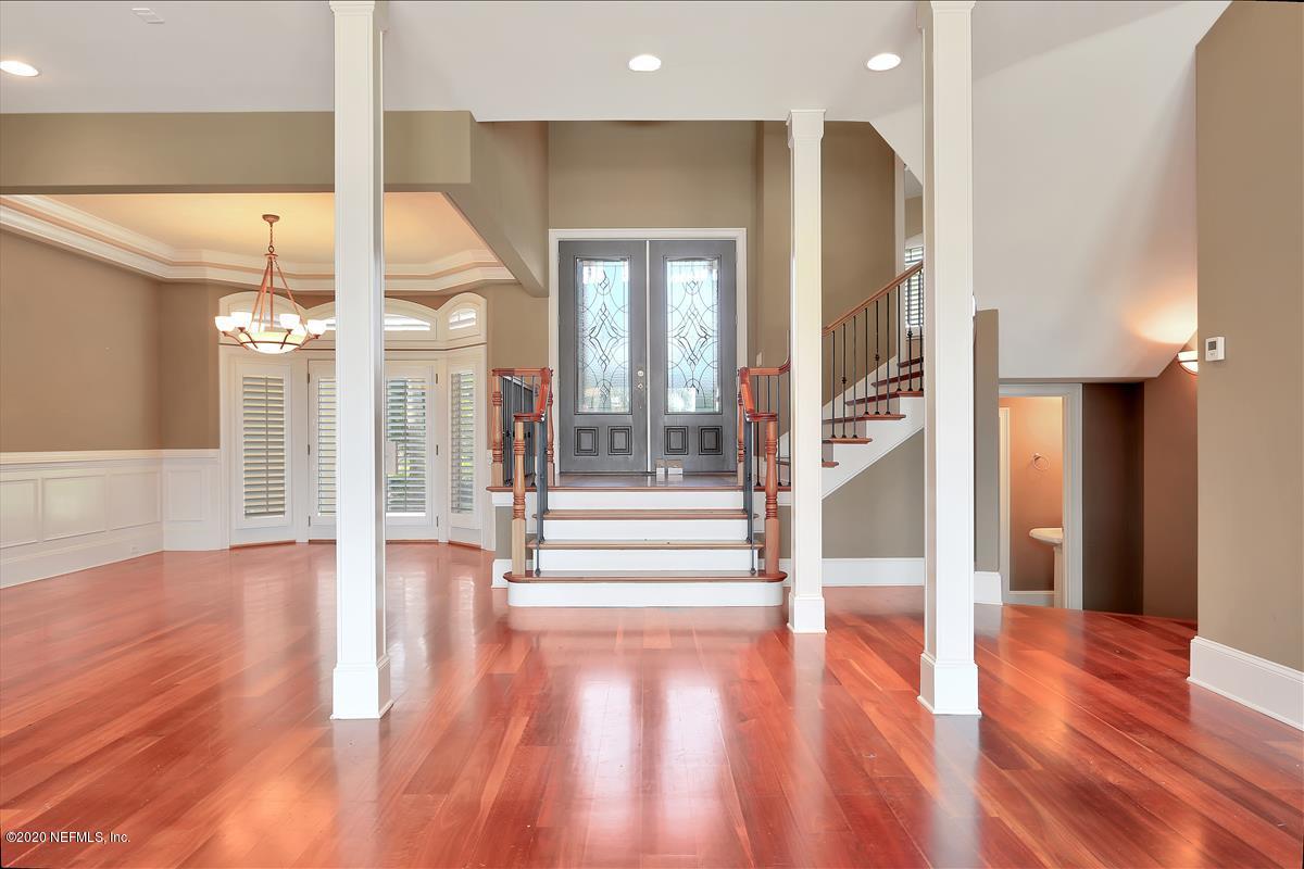 96270 Captains Pointe Road Yulee, FL 32097 - Photo 2 of 34 a view of an entryway with dining room and wooden floor