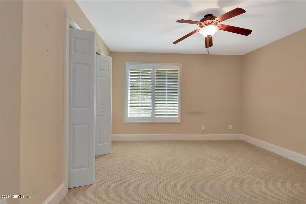 96270 Captains Pointe Road Yulee, FL 32097 - Photo 21 of 34 an empty room with a window and a fan