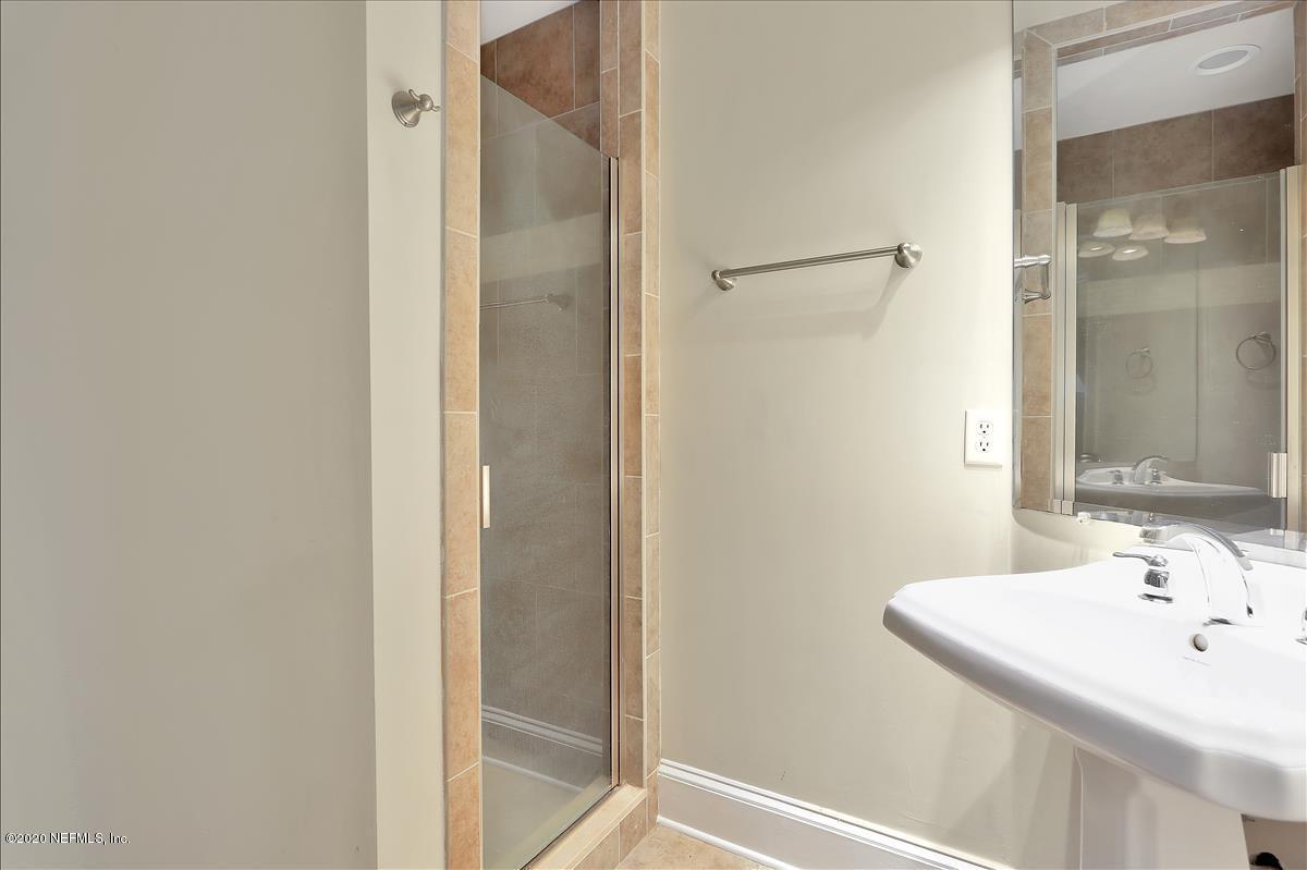 96270 Captains Pointe Road Yulee, FL 32097 - Photo 23 of 34 a bathroom with a sink and a mirror