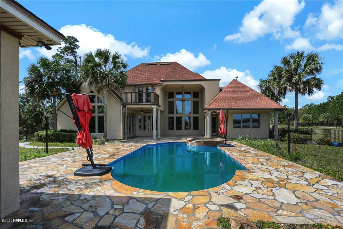 96270 Captains Pointe Road Yulee, FL 32097 - Photo 27 of 34 a view of a house with swimming pool and sitting area