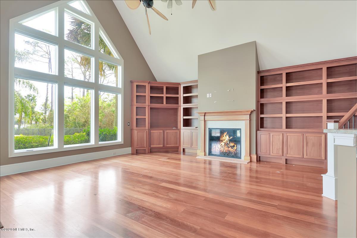 96270 Captains Pointe Road Yulee, FL 32097 - Photo 5 of 34 a view of an empty room with wooden floor and a window