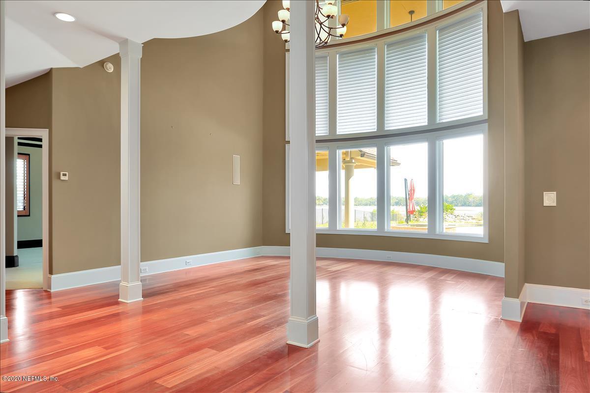 96270 Captains Pointe Road Yulee, FL 32097 - Photo 6 of 34 a view of an empty room with wooden floor and a window