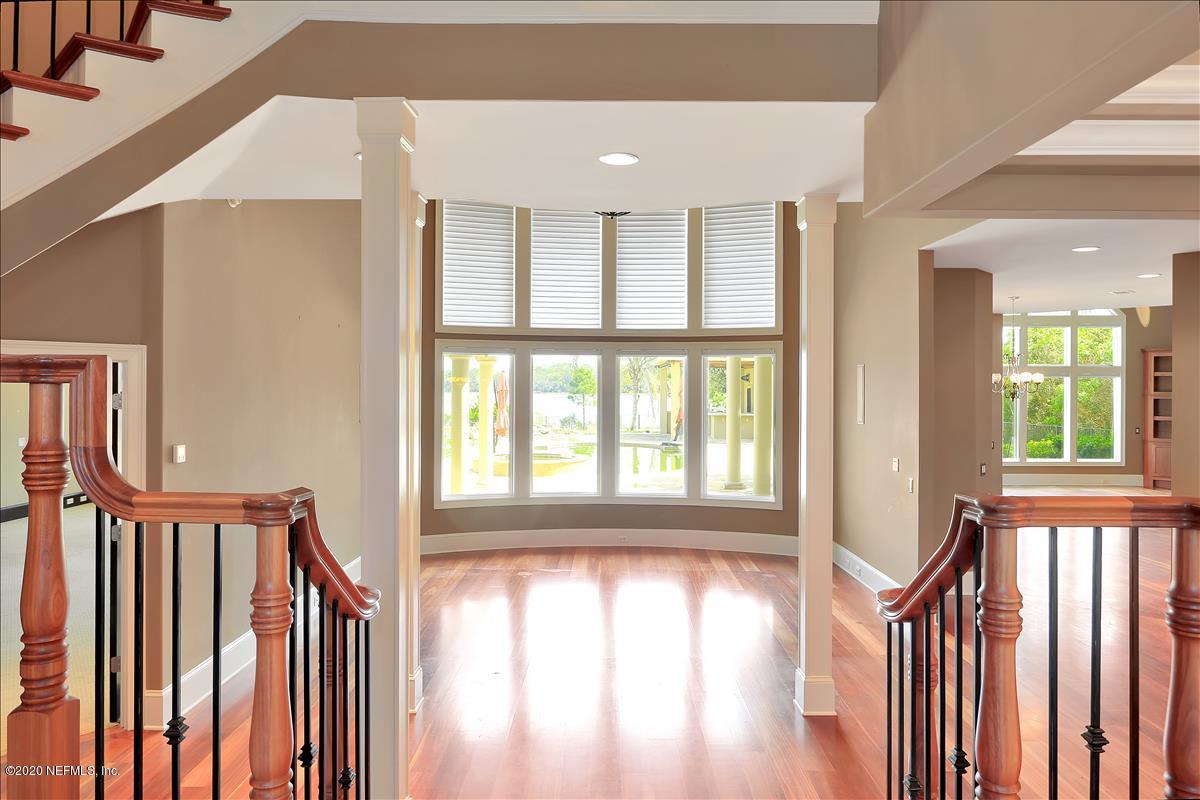 96270 Captains Pointe Road Yulee, FL 32097 - Photo 7 of 34 a view of an entryway with wooden floor and door