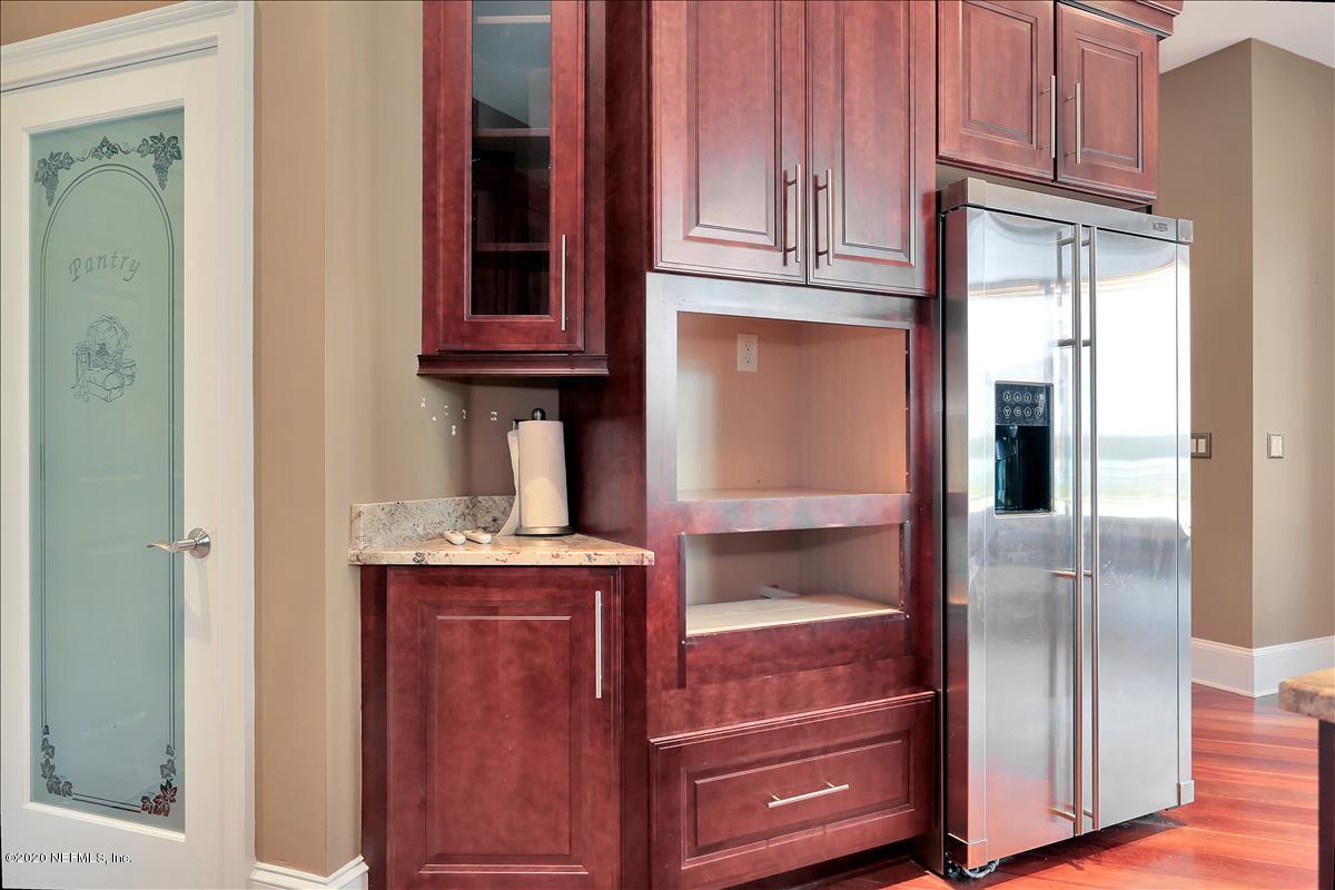 96270 Captains Pointe Road Yulee, FL 32097 - Photo 9 of 34 a kitchen with stainless steel appliances granite countertop a refrigerator and a cabinets