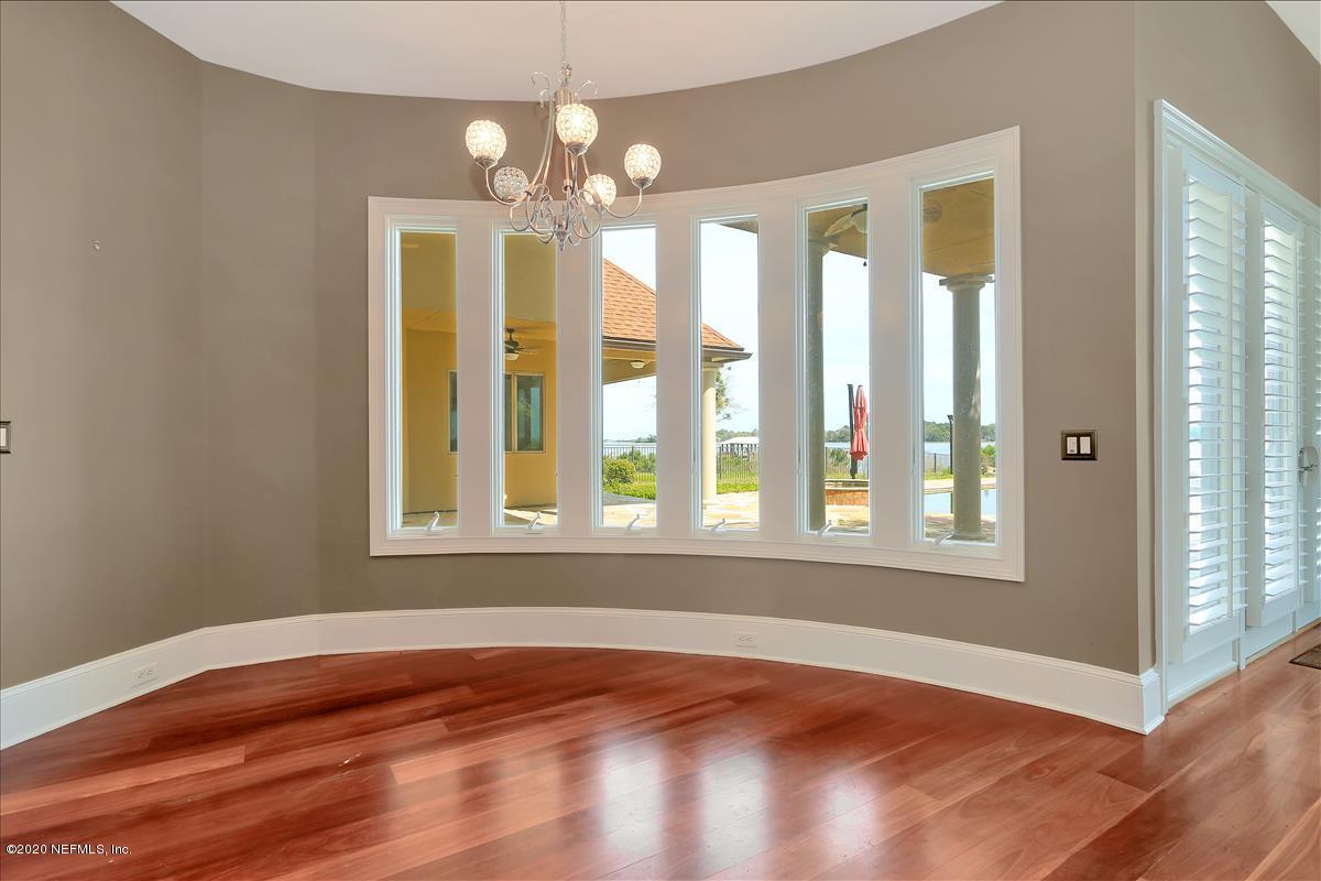 96270 Captains Pointe Road Yulee, FL 32097 - Photo 10 of 34 a view of an empty room with wooden floor and a window