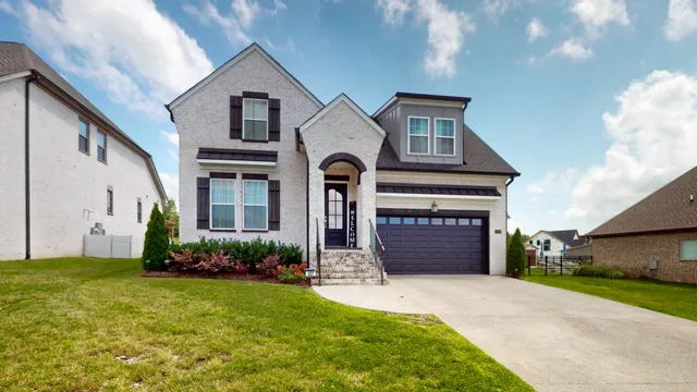 a front view of a house with a yard