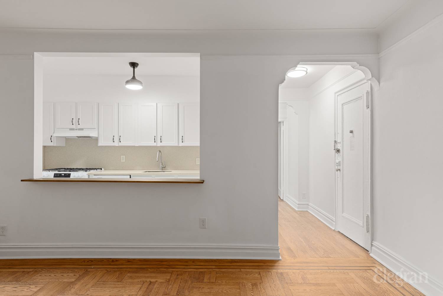 34-20 83rd Street, Unit 2I Queens, NY 11372 - Photo 3 of 9 a kitchen with a sink and cabinets