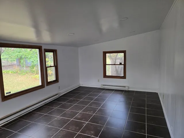 a view of an empty room with a window