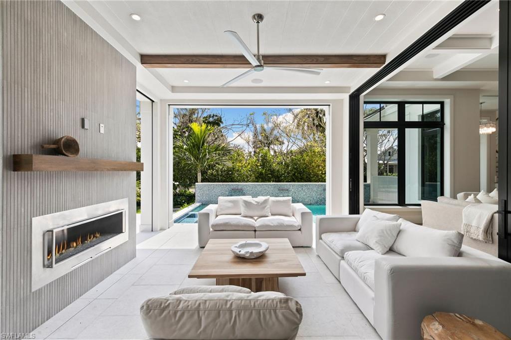 1191 7th Avenue North Naples, FL 34102 - Photo 18 of 49 Open to the Entire Main Living, this Outside Living has screens for use in the evening and Storm Shutters for Rain and Storm Protection