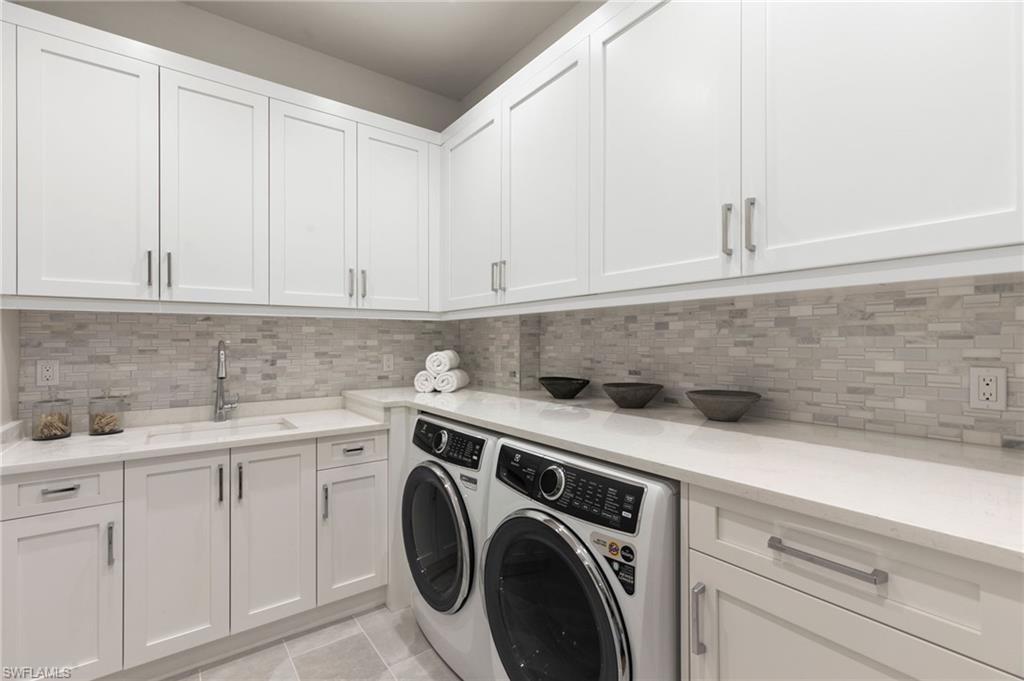 1191 7th Avenue North Naples, FL 34102 - Photo 31 of 49 Laundry Room main level provides everything you need fitted with Electrolux Washer/Dryer 2nd Laundry Upstairs